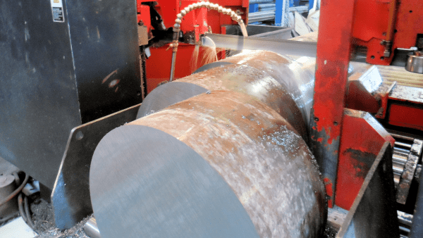 A large metal cylinder sitting on top of a machine.